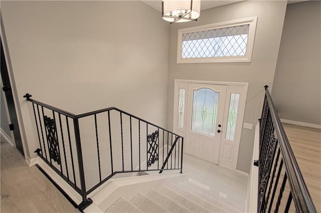 entrance foyer with a chandelier and light wood-type flooring