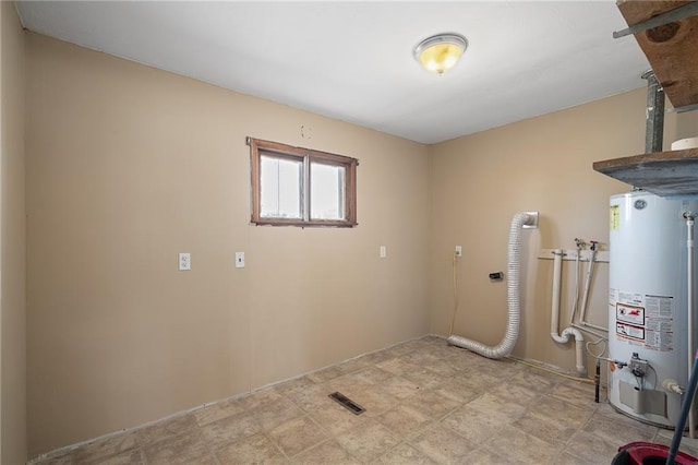 laundry area with water heater and washer hookup