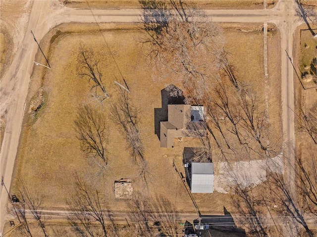 birds eye view of property with a rural view