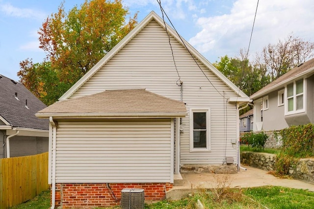 rear view of house with central air condition unit