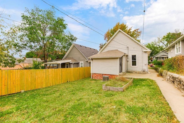 rear view of house with a lawn