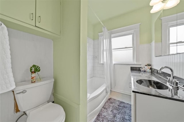 full bathroom featuring shower / tub combo, vanity, tile patterned floors, and toilet