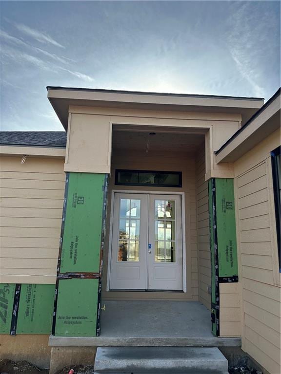 view of exterior entry featuring french doors