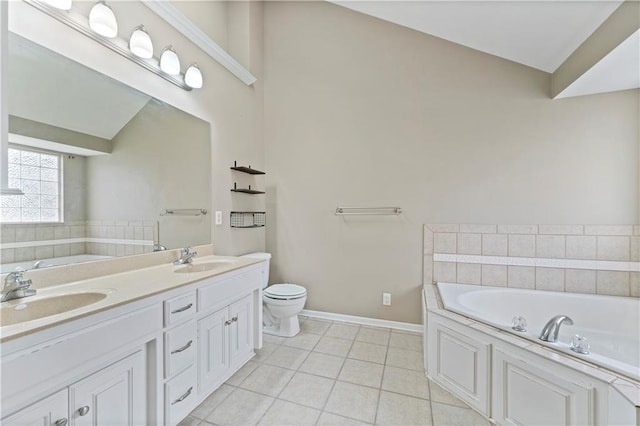 bathroom with vanity, tile patterned floors, toilet, and a bathing tub