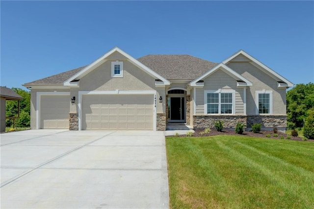 craftsman-style house with a garage and a front lawn