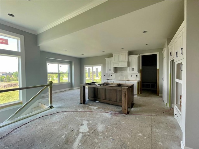 16577 W 165th Pl, Olathe, KS 66062 - kitchen featuring a center island, white cabinetry, and crown molding