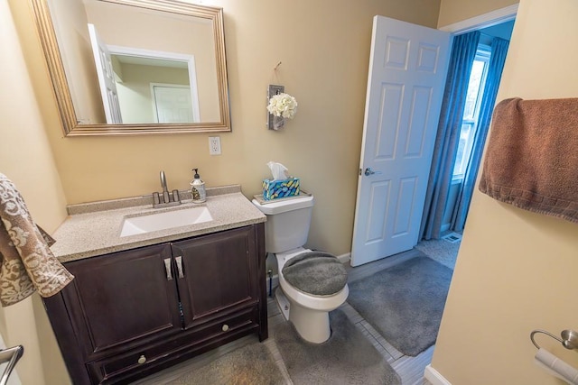 bathroom with vanity and toilet