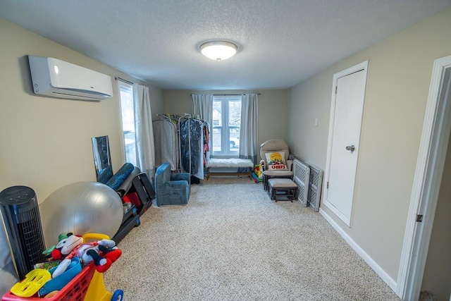 workout room featuring carpet, a wall unit AC, and a textured ceiling