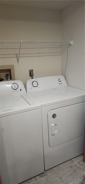 laundry area featuring independent washer and dryer