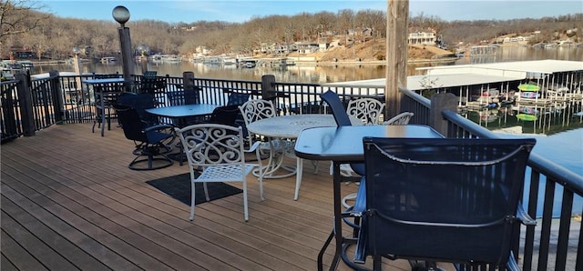 wooden deck featuring a water view