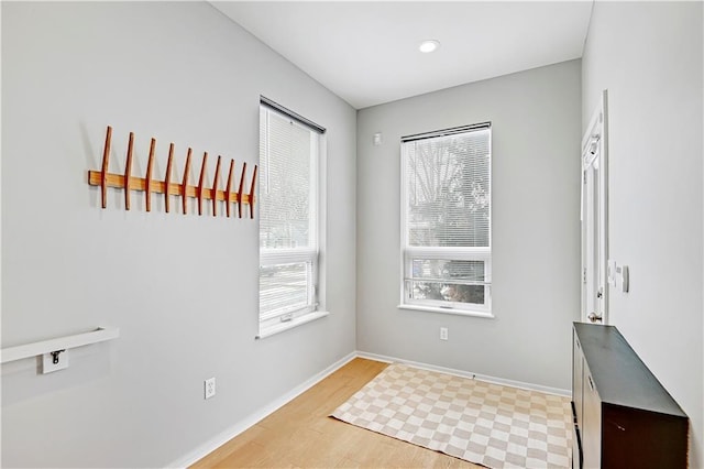 interior space with light wood-type flooring and baseboards