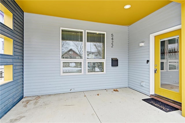 doorway to property with a patio