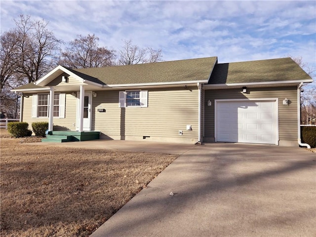 ranch-style home featuring a garage