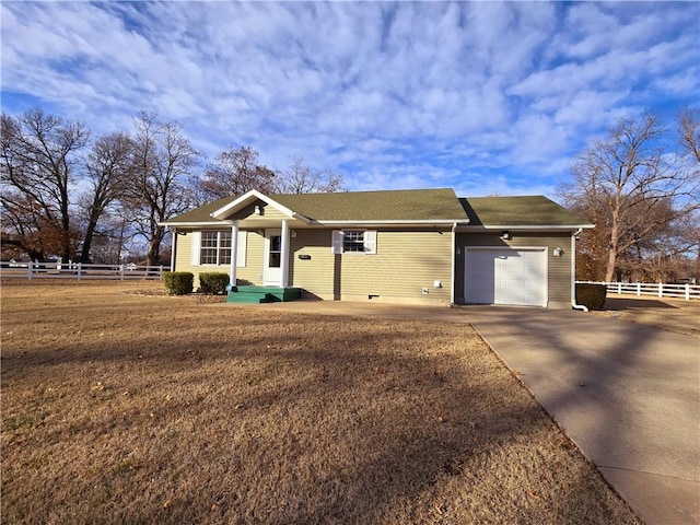 ranch-style home featuring a garage