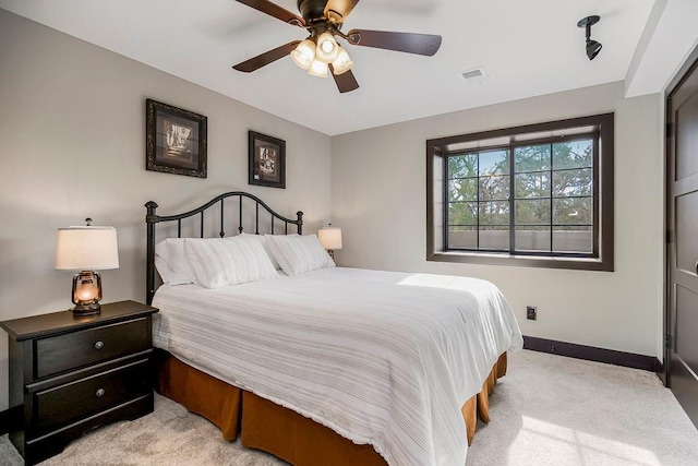 carpeted bedroom featuring ceiling fan