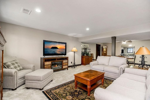 living room featuring light carpet