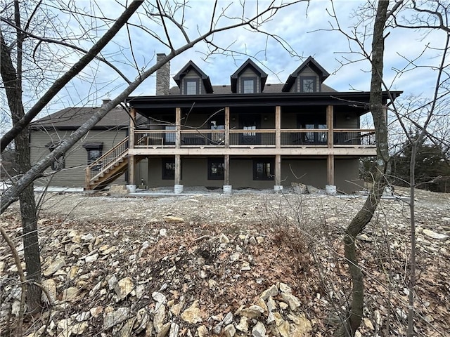 back of house with a wooden deck