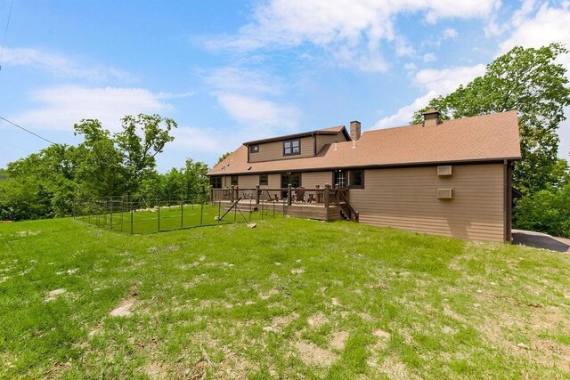 2909 S 74th St, Kansas City, KS 66106 - back of property with a chimney and a deck