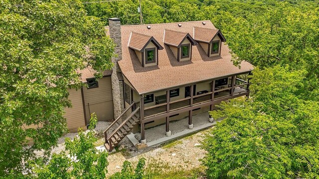 2909 S 74th St, Kansas City, KS 66106 - rear view of house with a chimney and roof with shingles