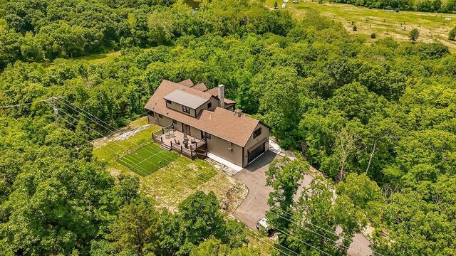 2909 S 74th St, Kansas City, KS 66106 - aerial view of property and surrounding area featuring a heavily wooded area