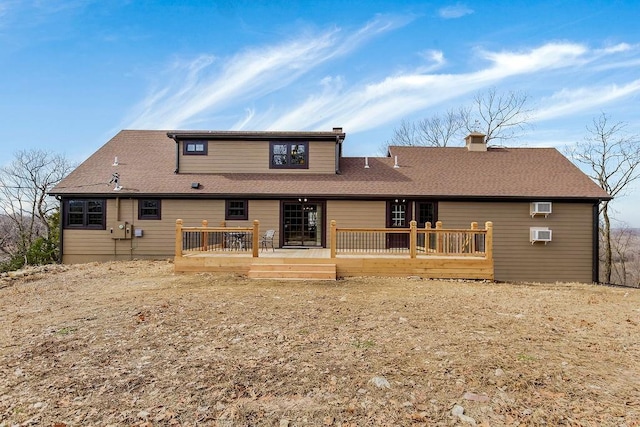 2909 S 74th St, Kansas City, KS 66106 - rear view of house with a chimney, a wooden deck, roof with shingles, and a wall mounted AC