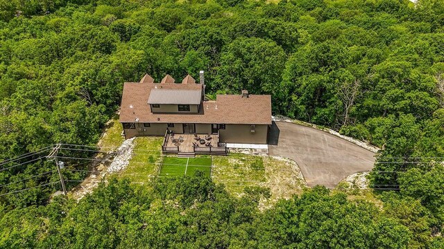2909 S 74th St, Kansas City, KS 66106 - aerial view of property and surrounding area with a heavily wooded area