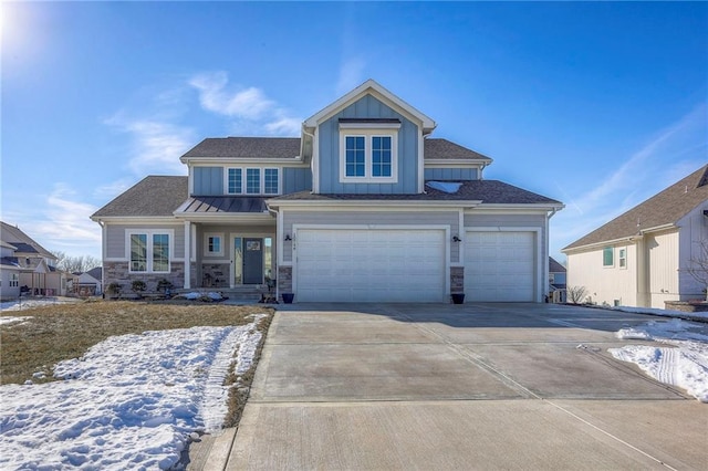 view of front of property with stone siding, board and batten siding, concrete driveway, and a garage