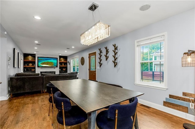 dining room with hardwood / wood-style flooring