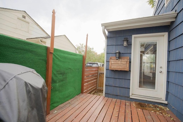 wooden terrace with area for grilling