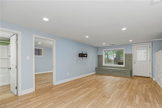 unfurnished living room featuring light hardwood / wood-style floors