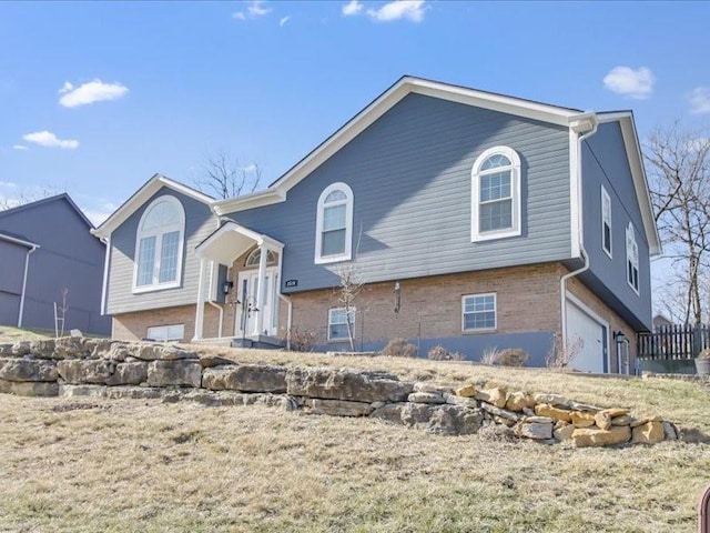 raised ranch featuring a garage