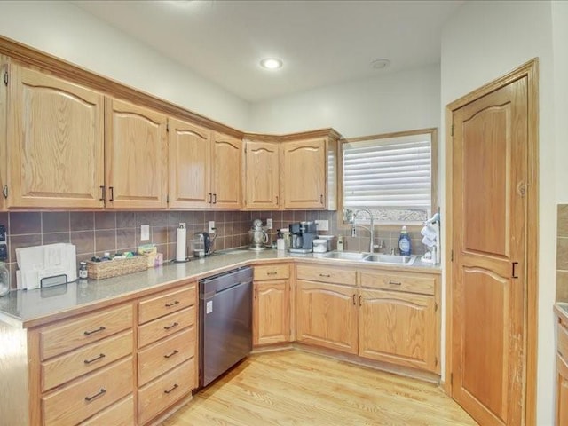 kitchen featuring sink, dishwasher, backsplash, light hardwood / wood-style floors, and light brown cabinetry