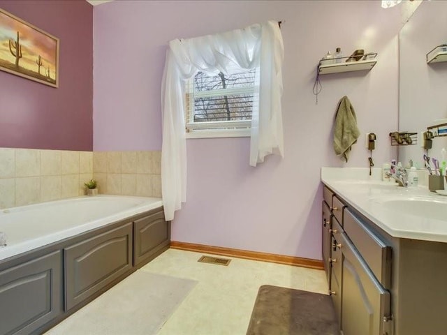 bathroom featuring vanity and a bathtub