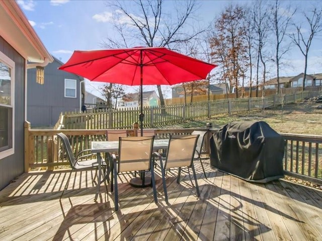 wooden terrace featuring grilling area