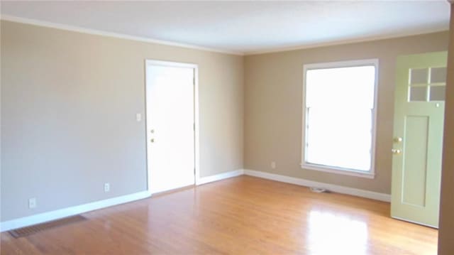 spare room featuring light hardwood / wood-style floors