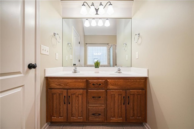 bathroom featuring a sink and double vanity