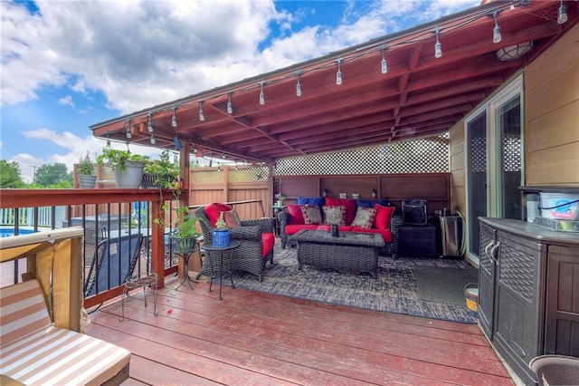 21465 W 180th St, Olathe, KS 66062 - wooden deck with an outdoor living space