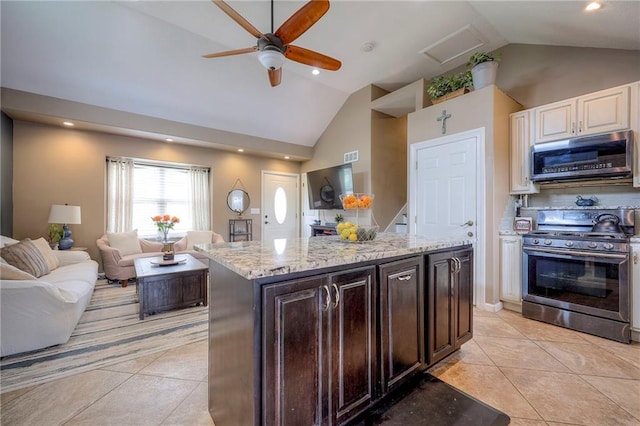 21465 W 180th St, Olathe, KS 66062 - kitchen with gas stove, light tile patterned flooring, light stone countertops, a ceiling fan, and recessed lighting