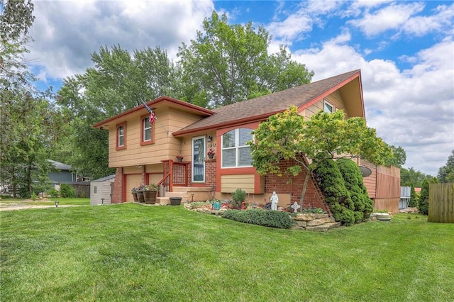21465 W 180th St, Olathe, KS 66062 - split level home featuring brick siding, a front yard, and a garage
