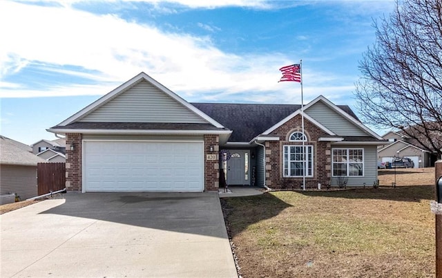 single story home with a garage and a front lawn