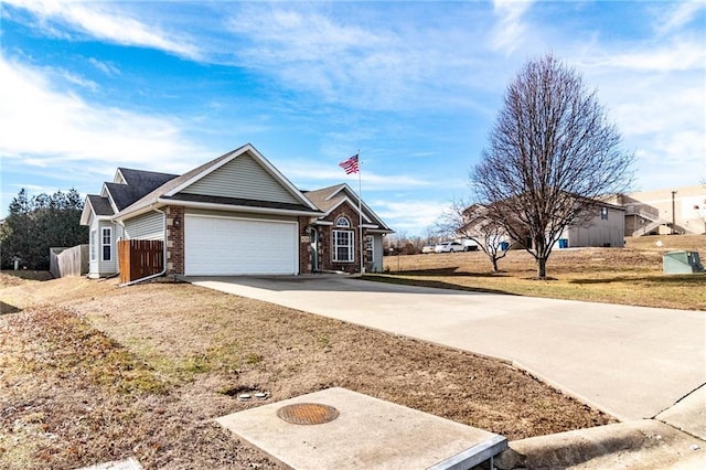 ranch-style home with a garage and a front yard