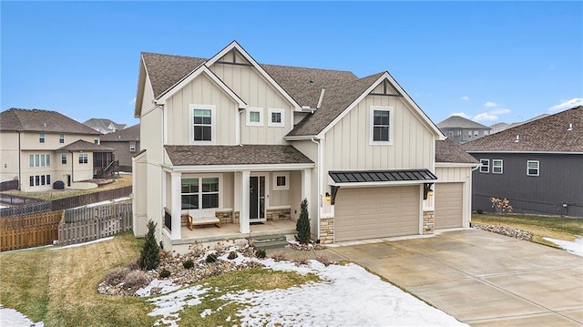 view of front of property with a garage and covered porch