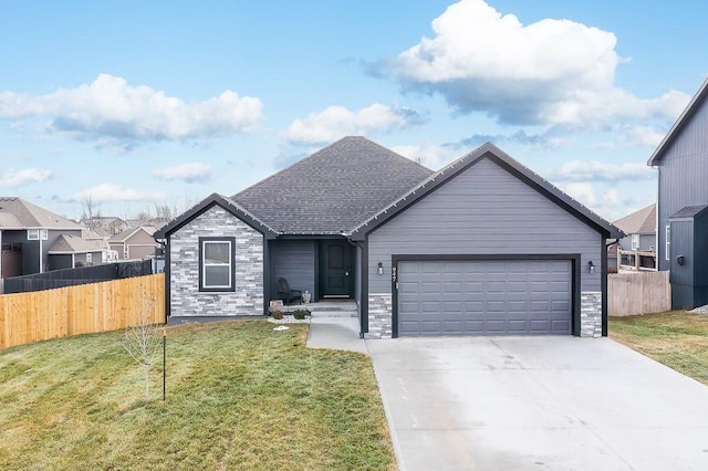 view of front of house with a garage and a front yard