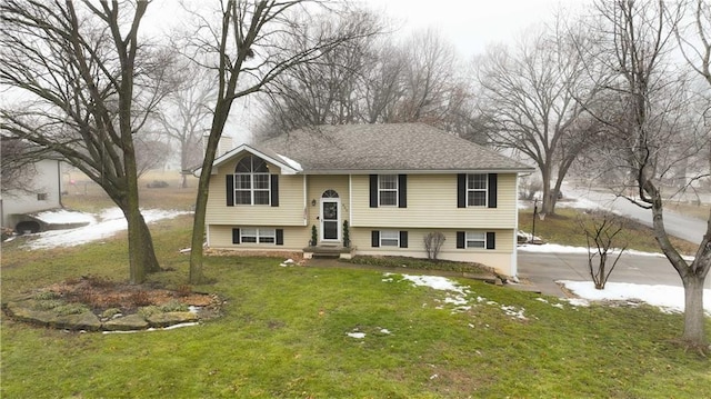 split foyer home with a front lawn