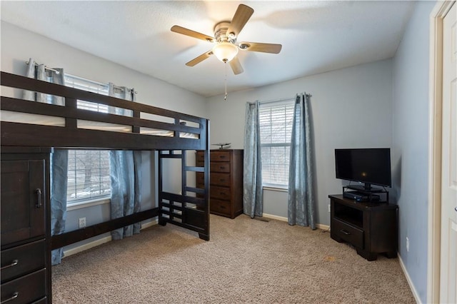 carpeted bedroom with ceiling fan