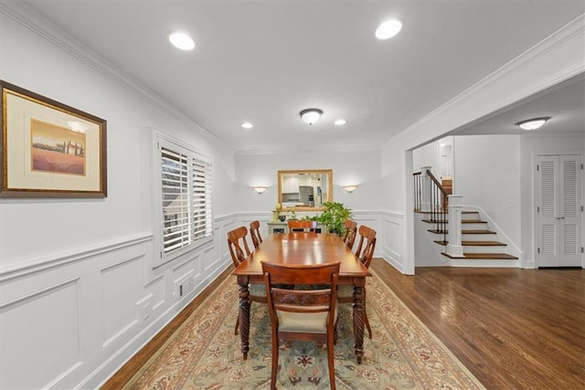 dining room featuring dark wood-type flooring and ornamental molding