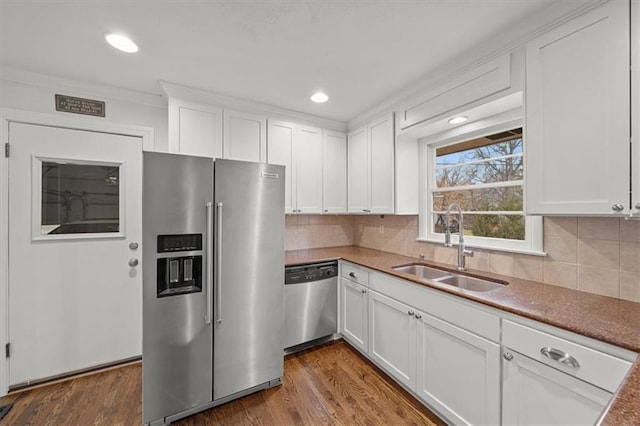 kitchen with white cabinetry, appliances with stainless steel finishes, and sink