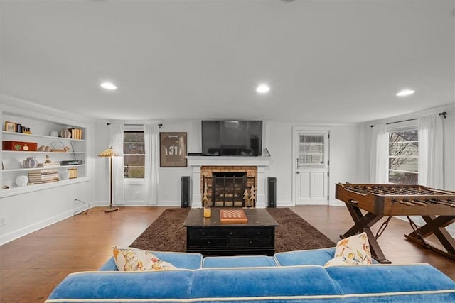 living room featuring hardwood / wood-style floors and a fireplace