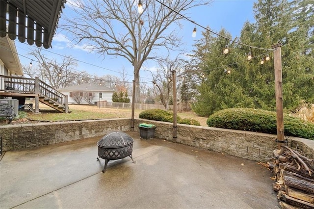 view of patio featuring an outdoor fire pit