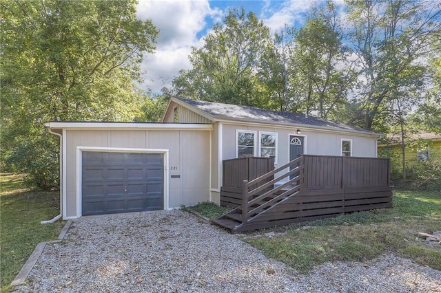 view of front of home featuring a garage and a deck